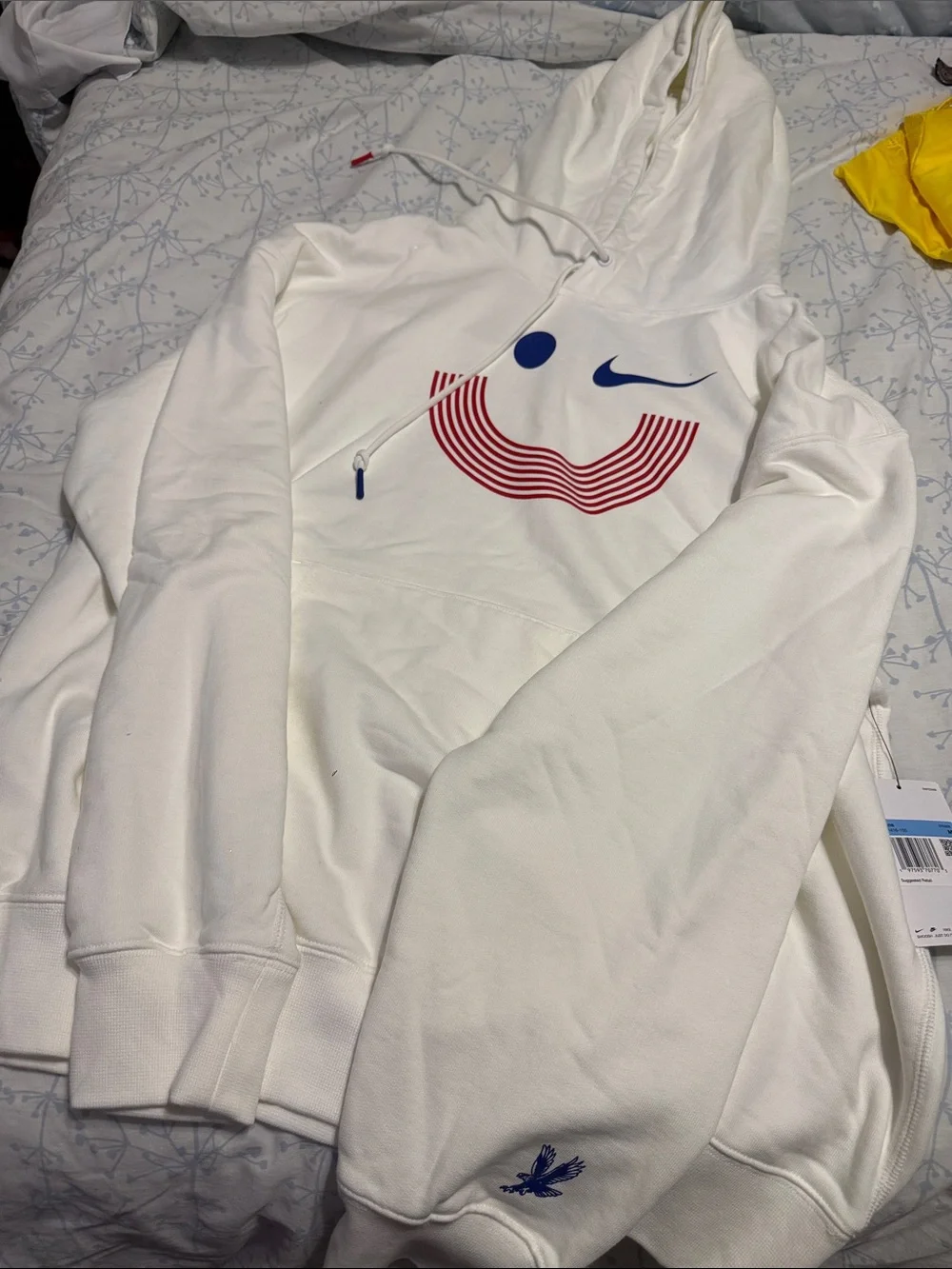 Nike White Hoodie with Red Smiley Stripes and Blue Accents